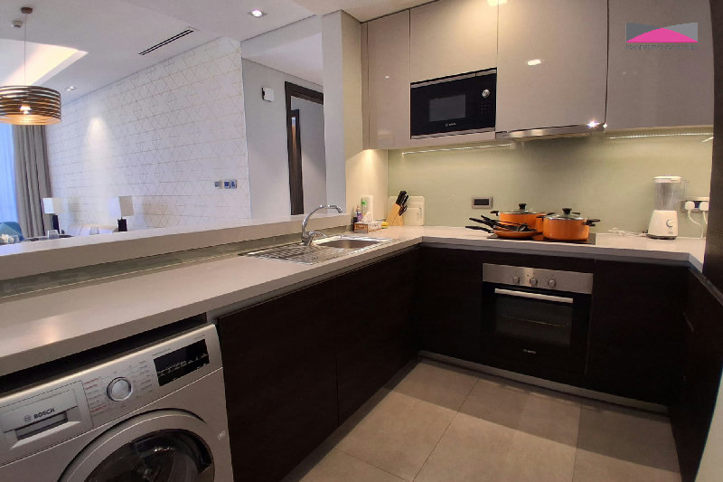 Stylish Seef Sanctuary | Elegant 1.5-Bedroom Living with City and Sea Views β Slide 4